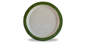 Breadfruit dinner plate with breadfruit textured rim and creamy glaze in bowl of plate. 