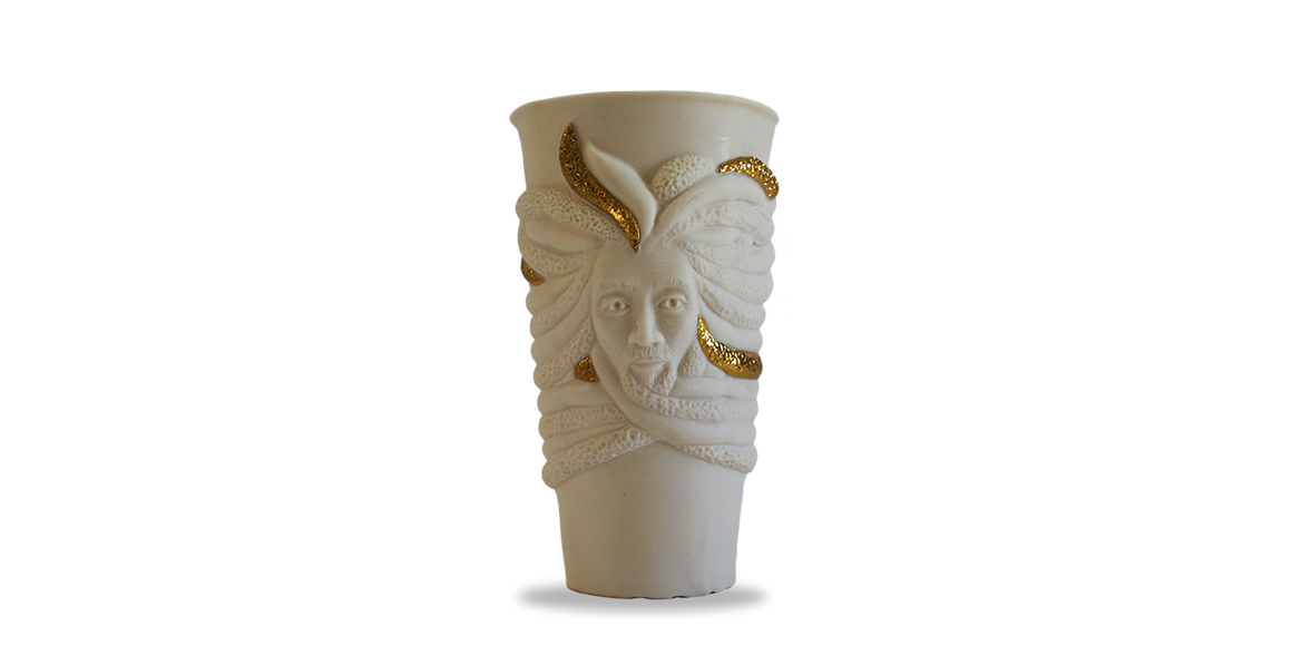 White porcelain cup with Jamaican Rastafarian face and dreadlocks wrapping around the cup with 18k gold accent  on  some of the locks. Authentic Jamaican Rasta Cup